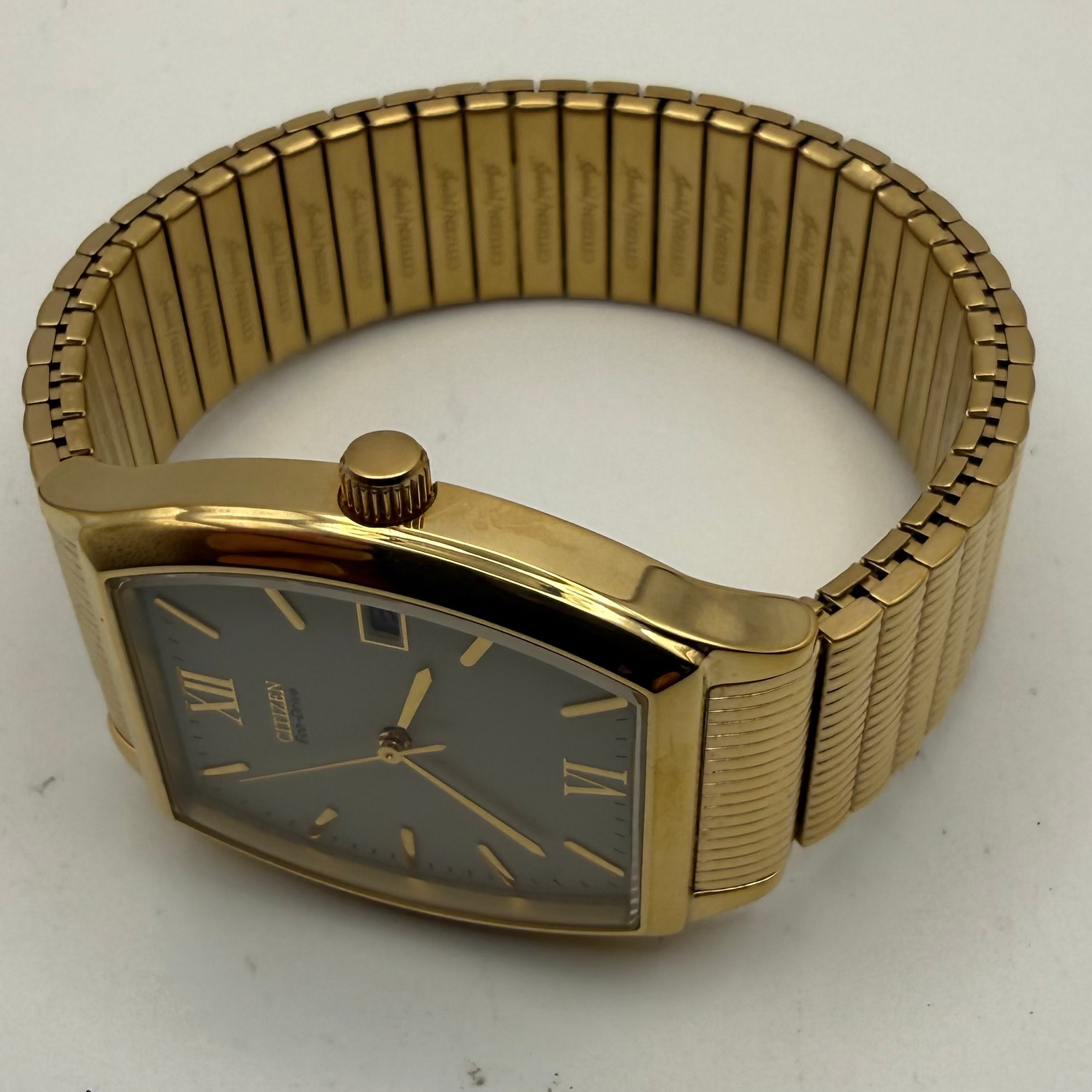 Citizen Eco-Drive E111-S038354 Gold Tone Tonneau Date Watch- £90.00