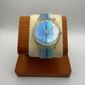 Classic Swatch Quartz Watch featuring a clean minimalist dial with blue gradient stripe- £28.99
